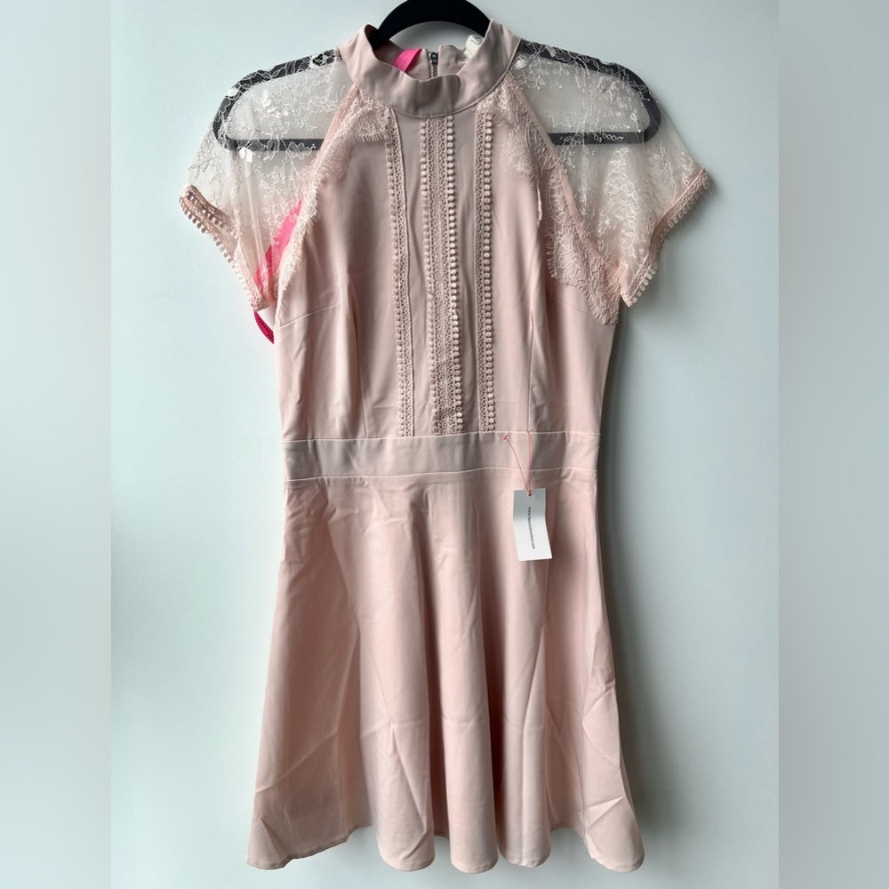 Pink/peachy mid length dress. Brand new with tag. Size 4 US